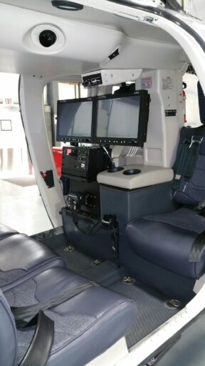 Dual 21" HD monitor setup in the back of a Cessna Caravan 208